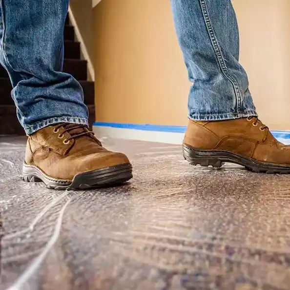 Wide view of Presto carpet film covering large carpeted floor area in residential home
