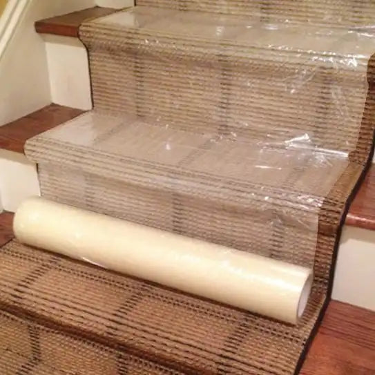 Presto carpet protection film applied securely to carpeted stairs for temporary coverage
