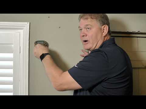 technician demonstrating how to use the Protimeter MMS3 for moisture and humidity detection
