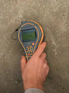 using protimeter mms3 in pinless mode to scan moisture on a wood surface
