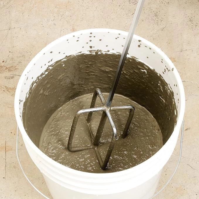 QEP Super Mixer Paddle in use mixing mortar in a construction bucket
