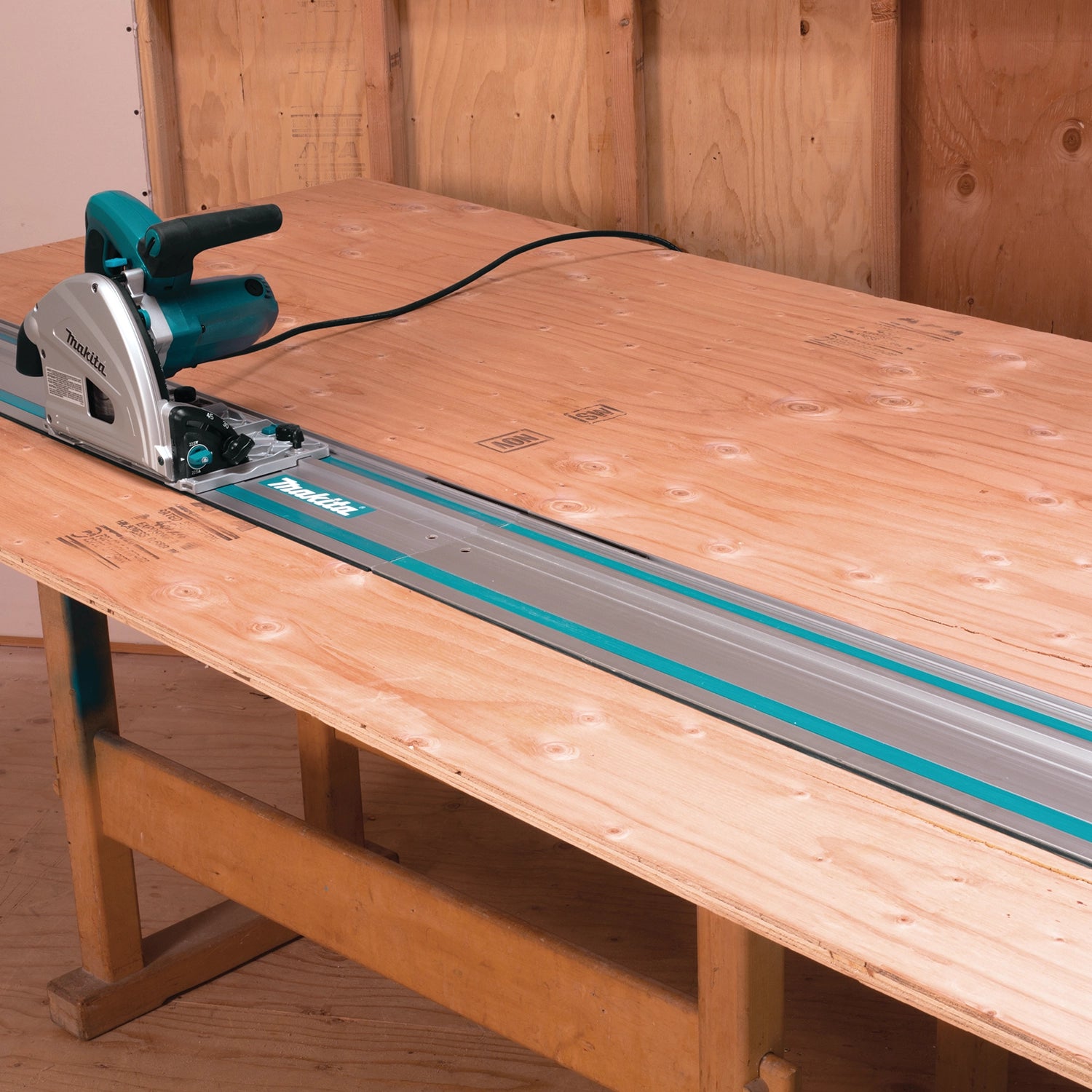 makita plunge saw mounted on guide rail connected for accurate long cuts
