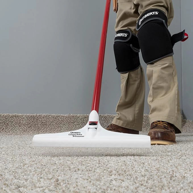 Carpet rake head resting on job site floor ready for grooming
