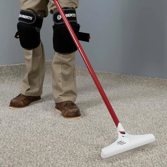 Roberts Carpet Groomer pulling through dense carpet to restore pile
