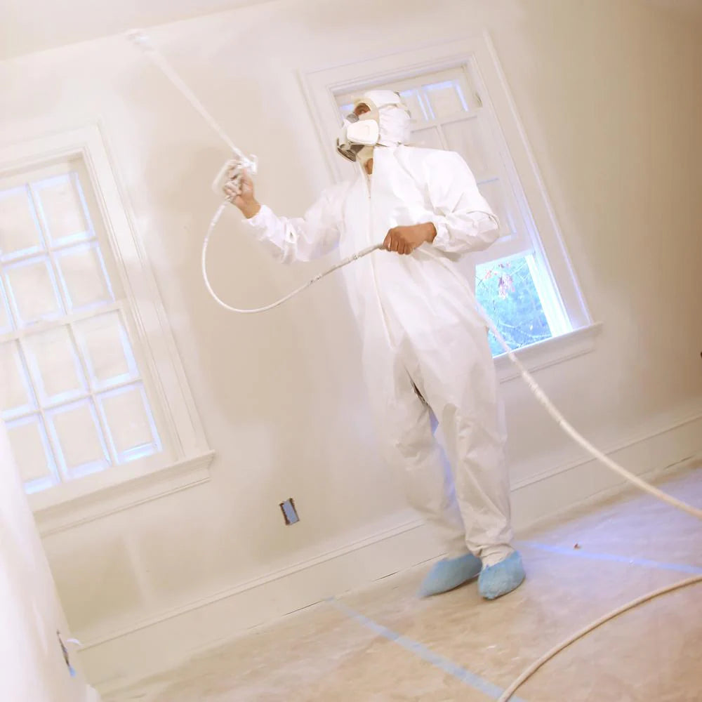 Trimaco disposable shoe guards worn while spraying for containment or restoration
