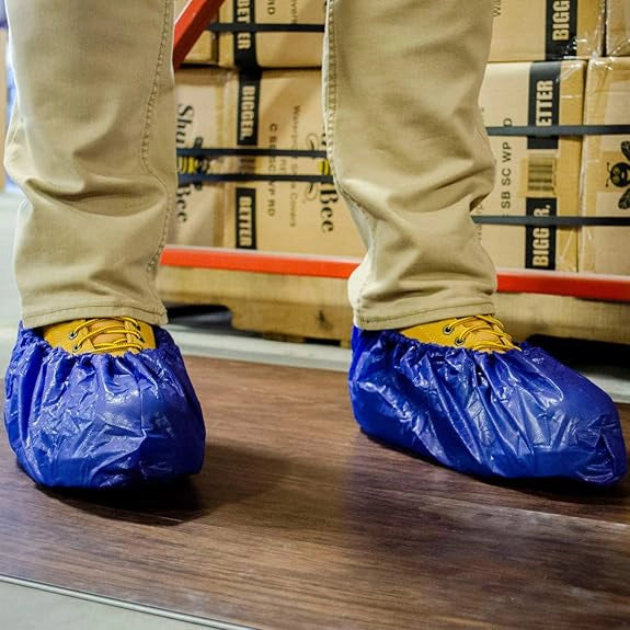 Shubee waterproof shoe covers worn on feet during restoration work
