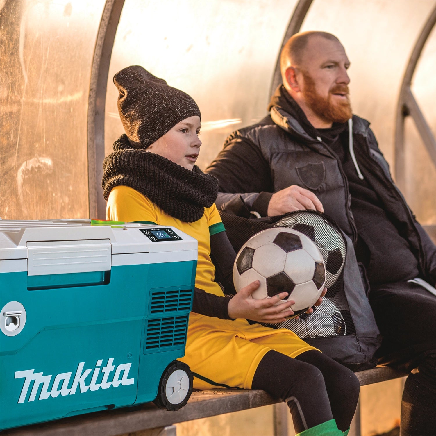makita cooler warmer box on grass during soccer practice or recreational event
