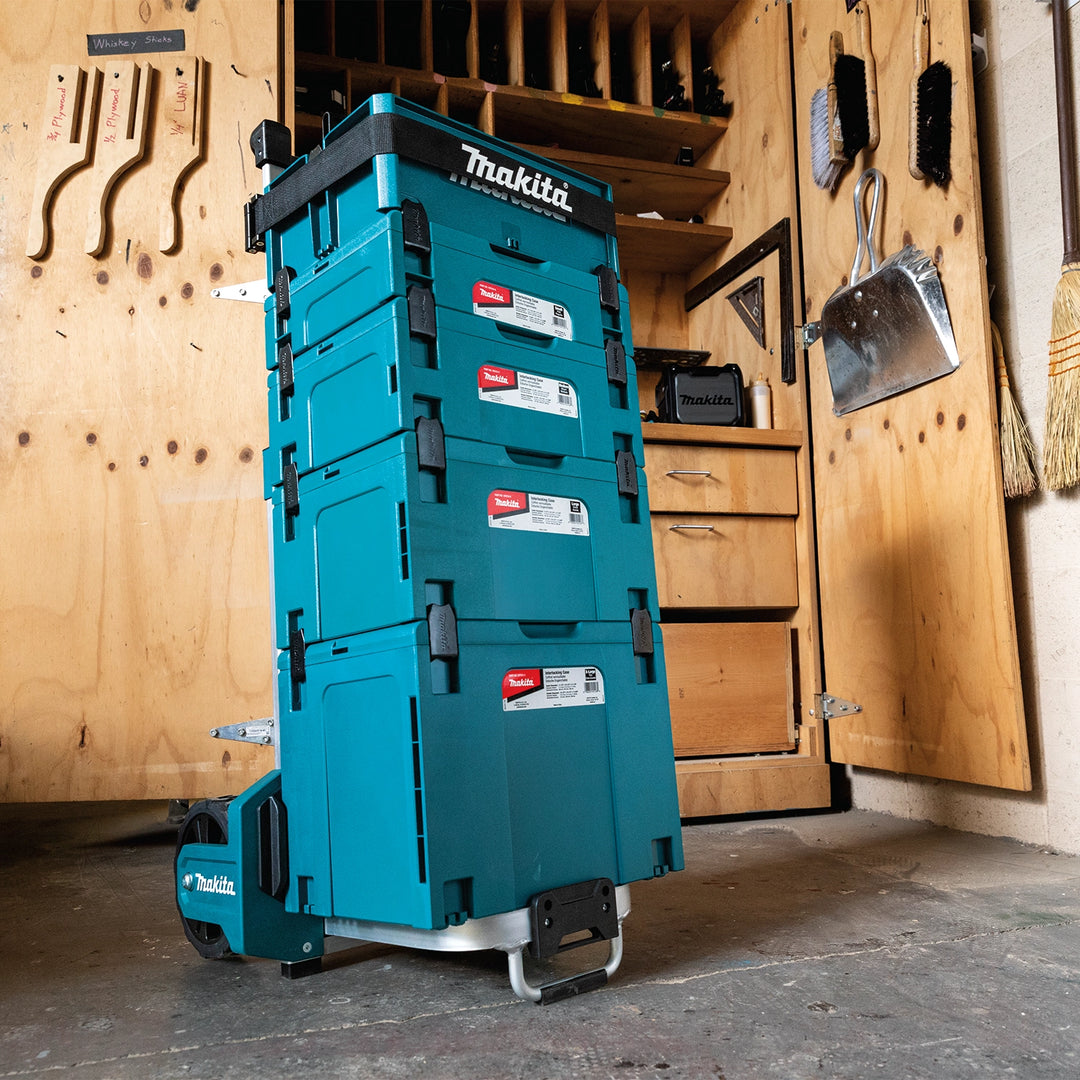 stacked makita cases in use at jobsite work area
