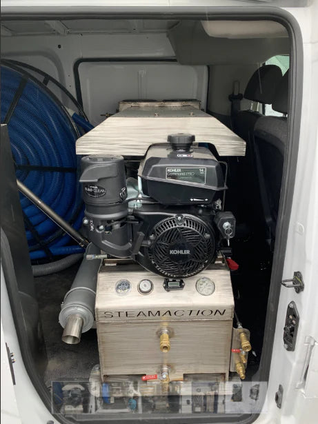 Steamaction Nike 3030 truckmount professionally installed in service van with visible Kohler engine, control panel, and vacuum hose reel—ready for mobile carpet cleaning and restoration.
