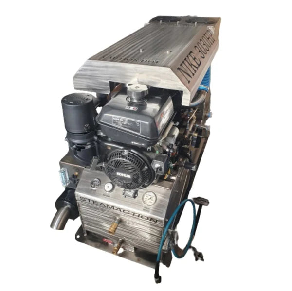 Top-front angled view of the Steamaction Nike 3030 truckmount with visible Kohler engine, stainless steel body, and solution/recovery tank ports—designed for professional carpet cleaning and restoration use