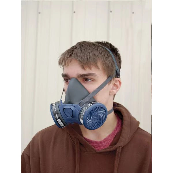 Another technician using Moldex 7000 respirator while working indoors
