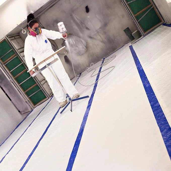 Trimaco Aqua Shield seam tape securing protective film on floor during renovation
