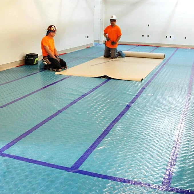 Trimaco Aqua Shield seam tape applied on hardwood floor seam to prevent liquid intrusion
