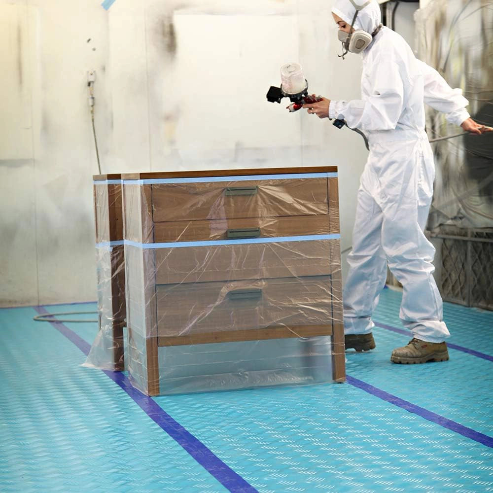 Trimaco Aqua Shield seam tape in use sealing floor covering edges at jobsite
