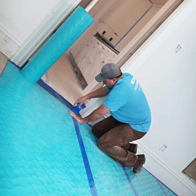 Trimaco Aqua Shield seam tape applied over Aqua Shield film on concrete flooring
