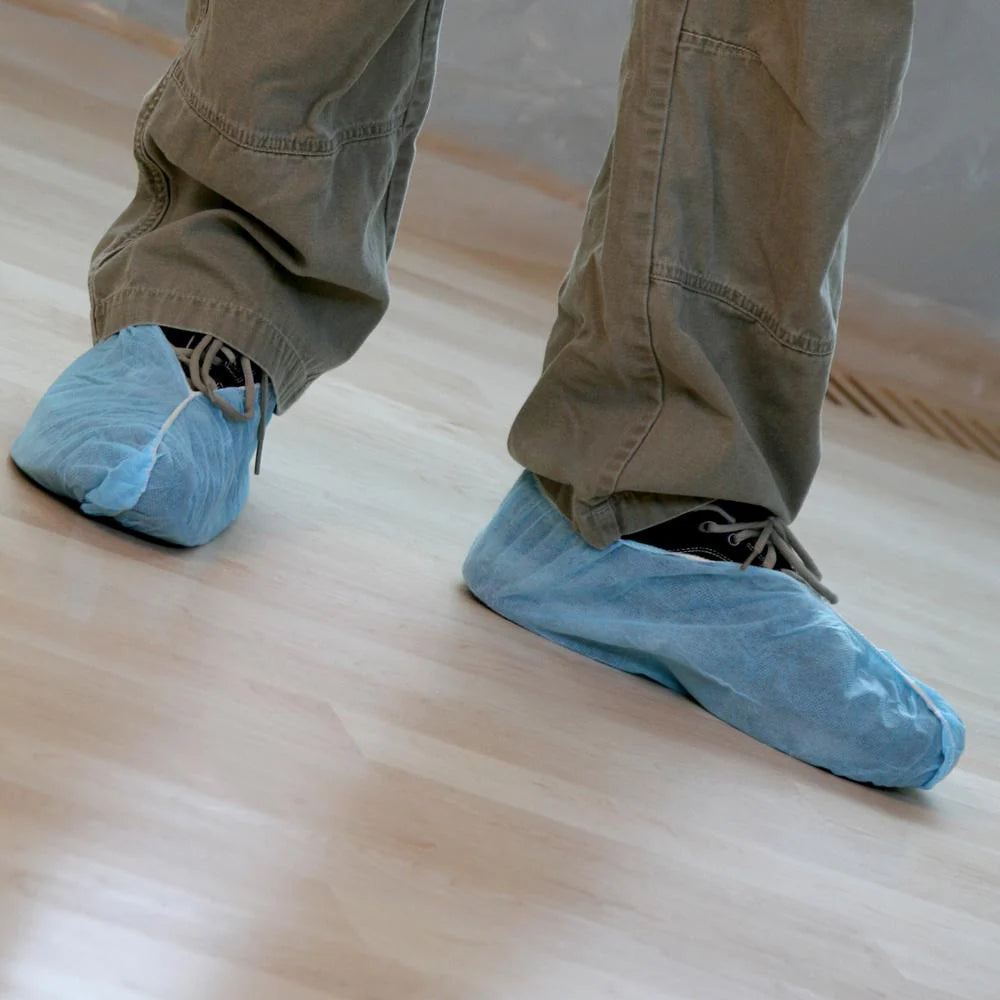 Trimaco Poly Shoe Guards in use protecting floors during restoration work
