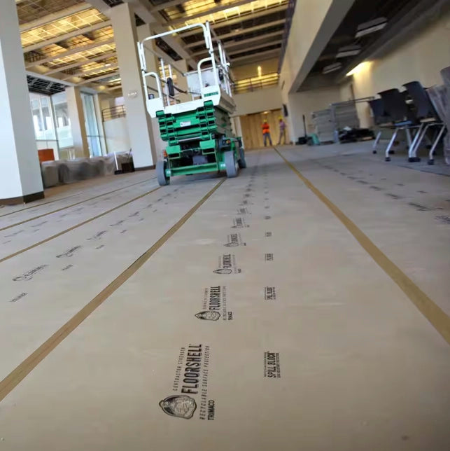 Wide shot of Trimaco seam tape securing floor protection in large commercial project
