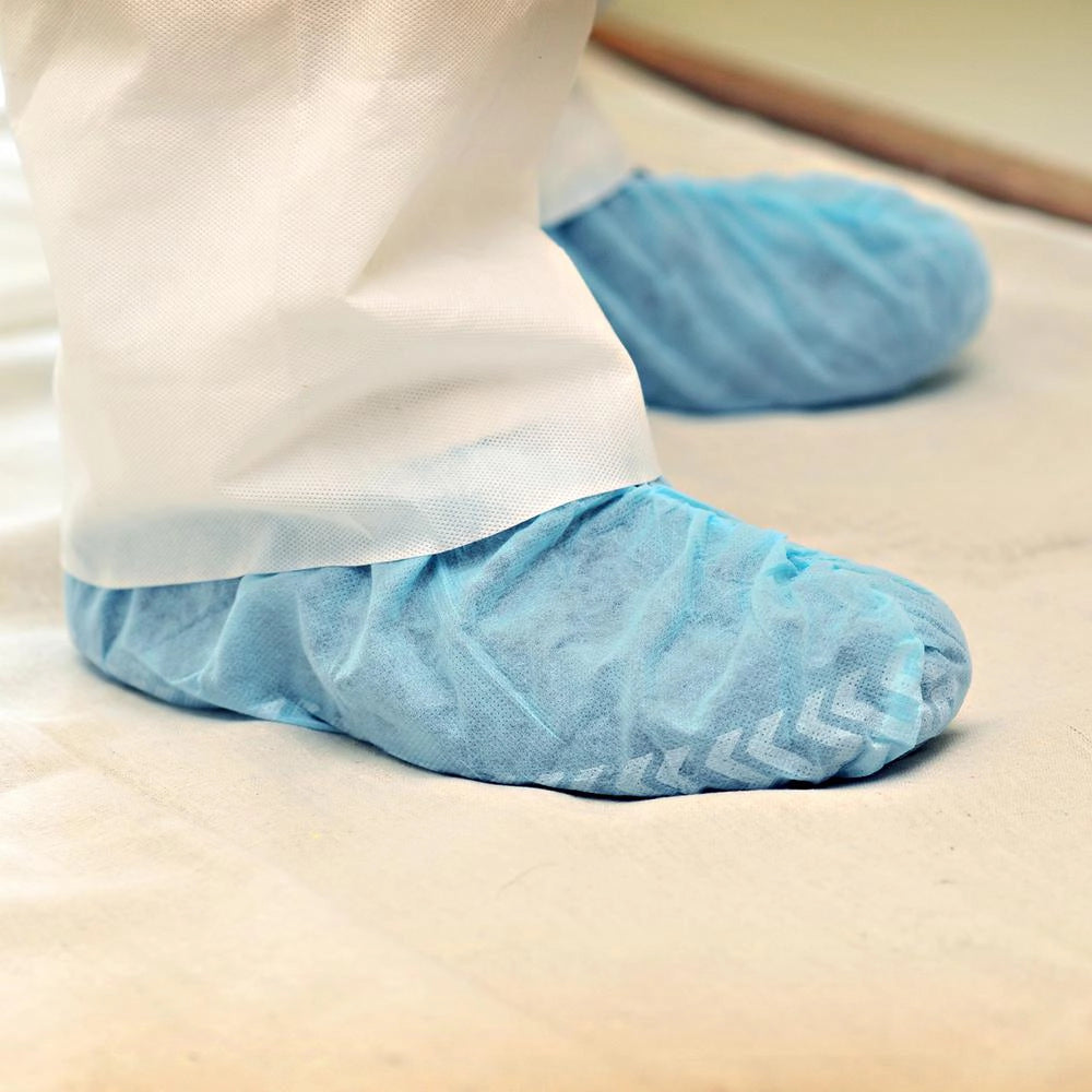 Trimaco disposable shoe covers worn on feet at jobsite
