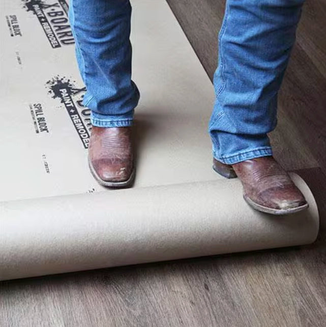Angled view of Trimaco X-Board being unrolled on jobsite floor
