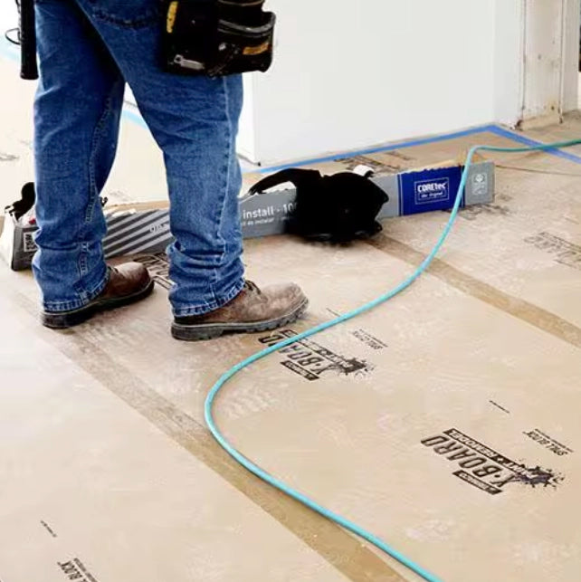 Jobsite floor fully covered with Trimaco X-Board during renovation

