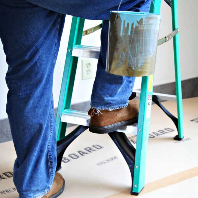 Trimaco X-Board floor protection under ladder during work
