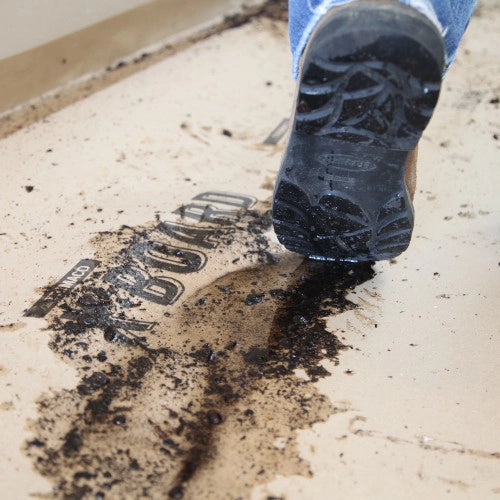 Trimaco X-Board protecting floor from muddy boots on jobsite
