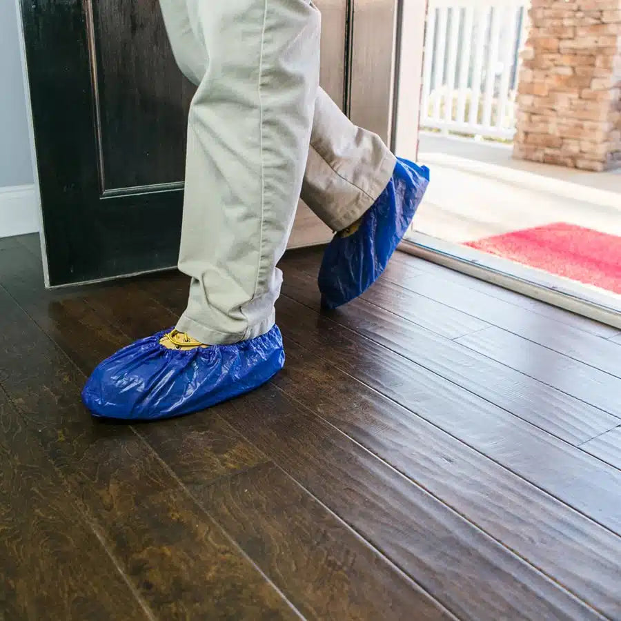 Walking on indoor flooring with Shubee waterproof non-slip shoe covers
