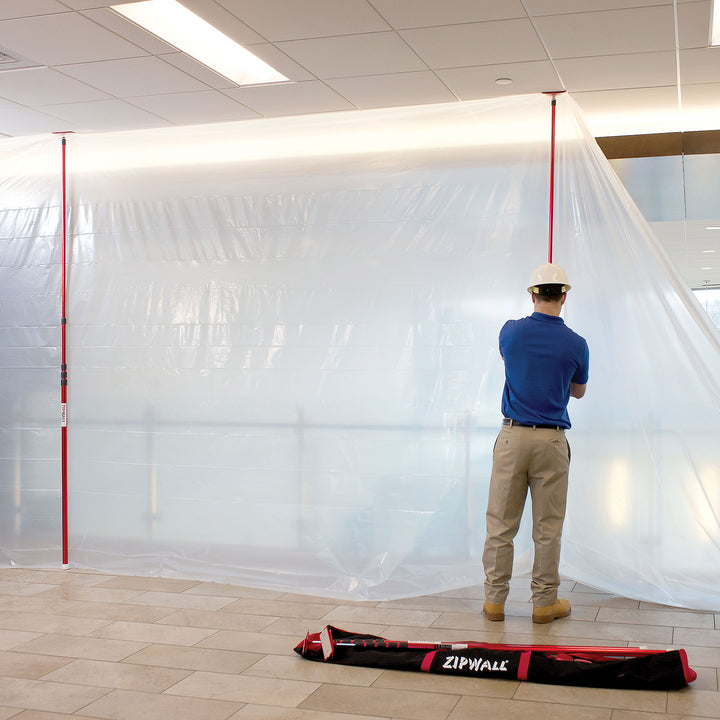 Full setup of ZipWall 20' pole system creating temporary containment wall
