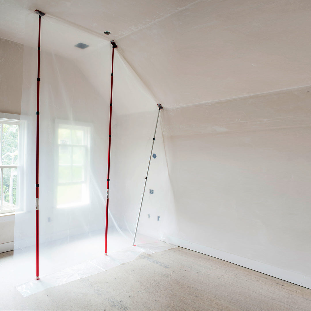 ZipWall extra-tall poles installed in room for dust and debris containment
