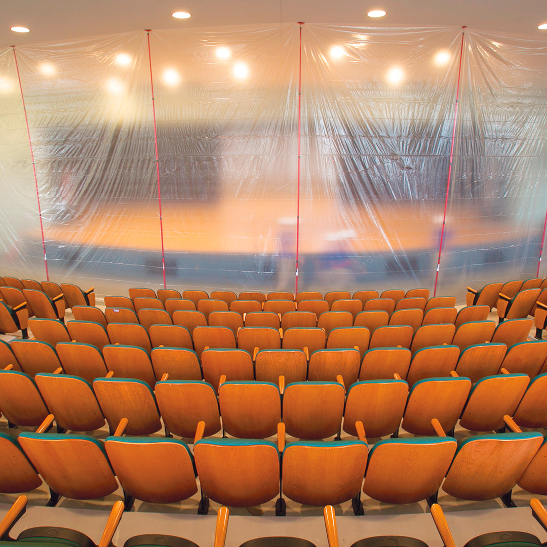 ZipWall 20-foot containment wall setup in theater space for restoration
