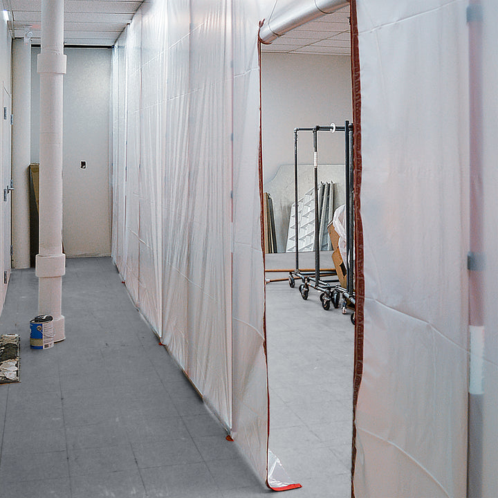 ZipWall tall containment poles used in building hallway with high ceilings
