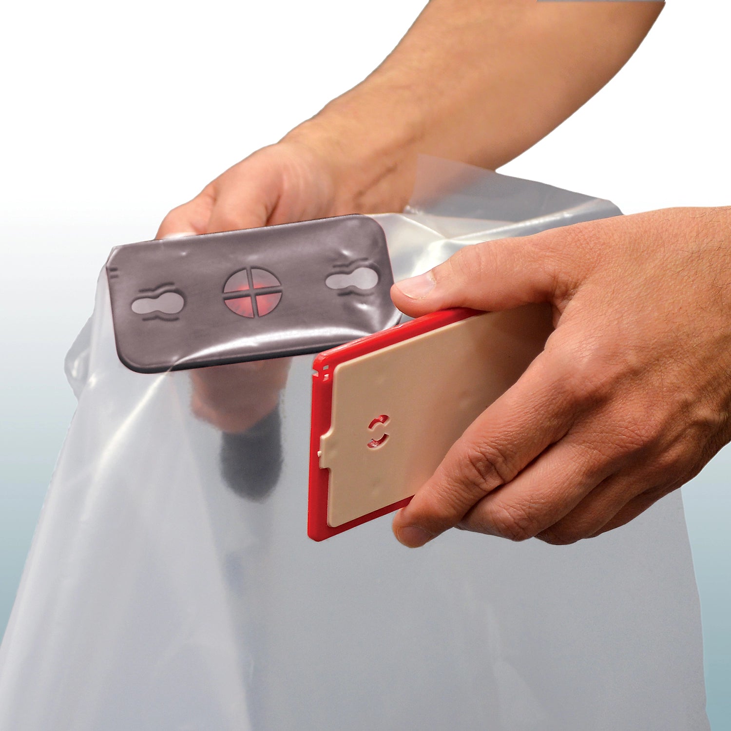 Zipwall Edge Head and Plate actively securing plastic sheeting on jobsite
