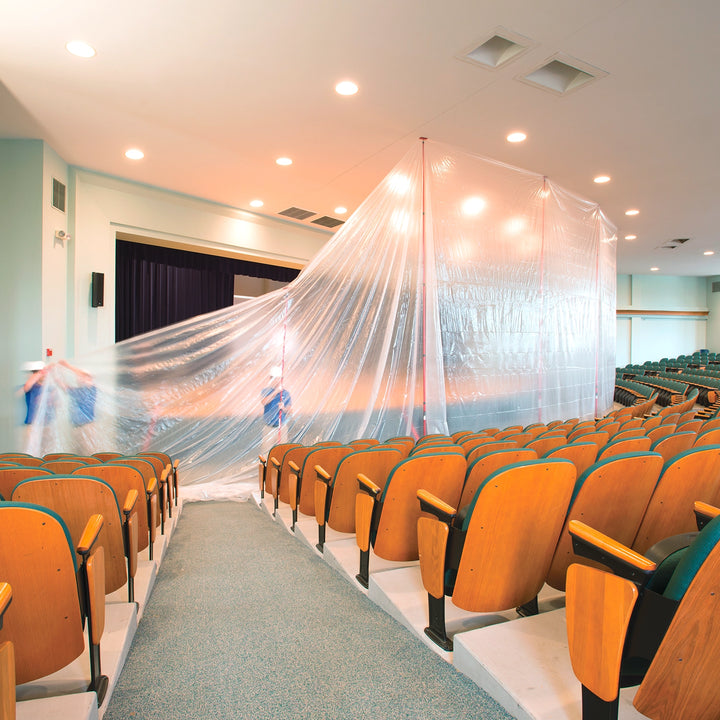 ZipWall containment barrier in theater setup for renovation dust control
