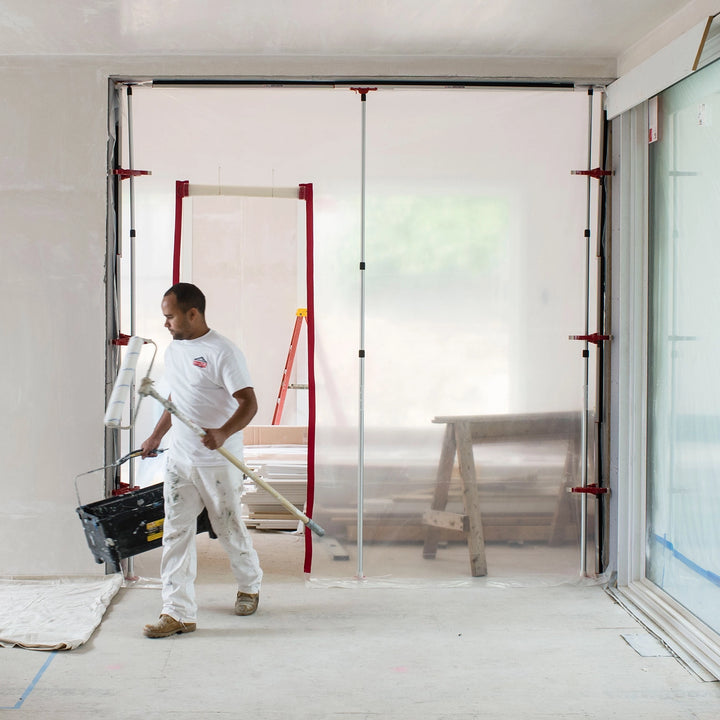 ZipWall SideClamp mounted securely on wall edge with plastic sheeting
